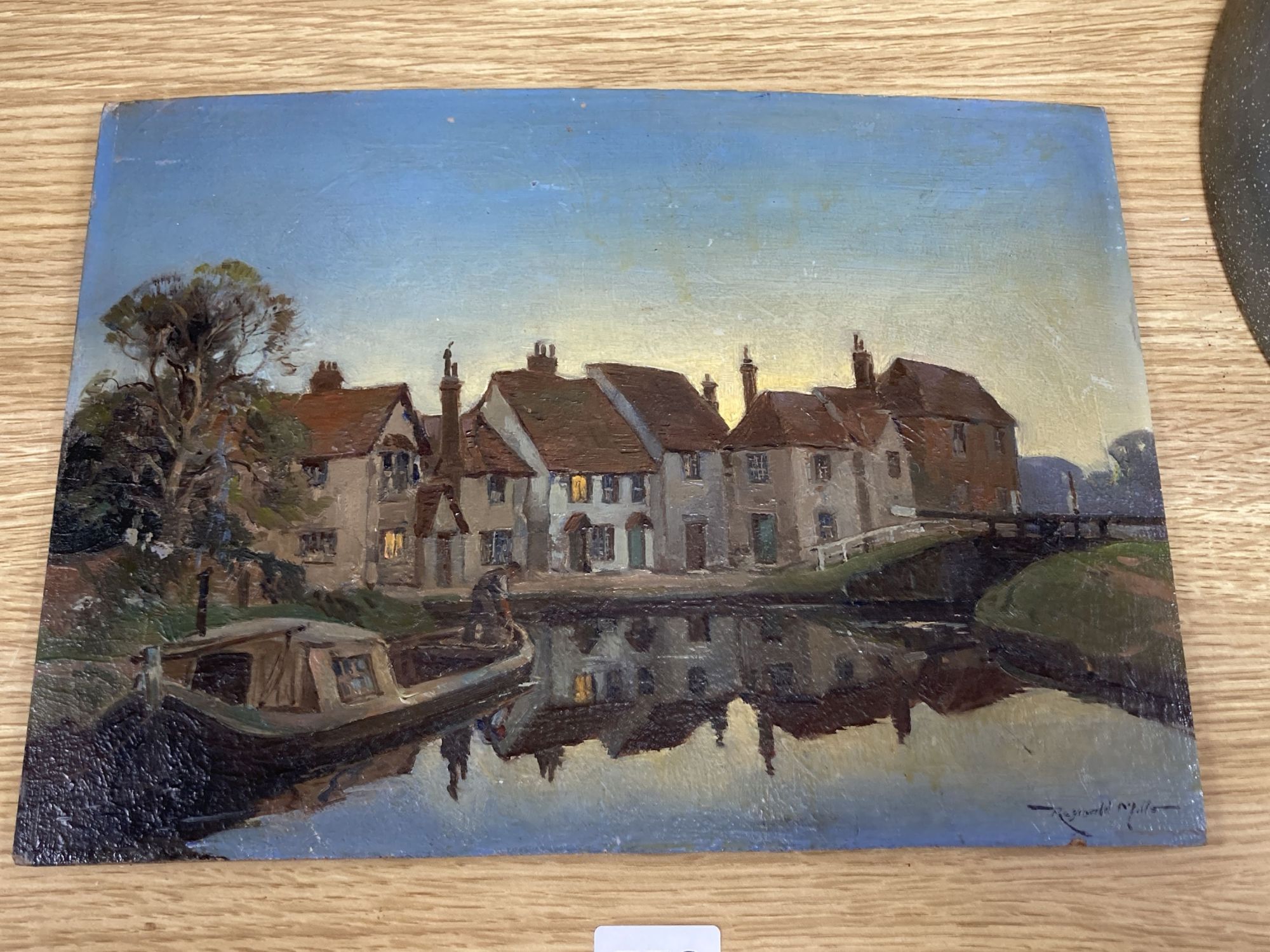 Reginald Mills (Exh.1921-38), oil on panel, Canal boat and cottages at dawn, signed, 21.5 x 30cm, unframed